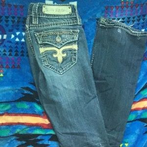 These are size 25 Rock Revival boot cut jeans.